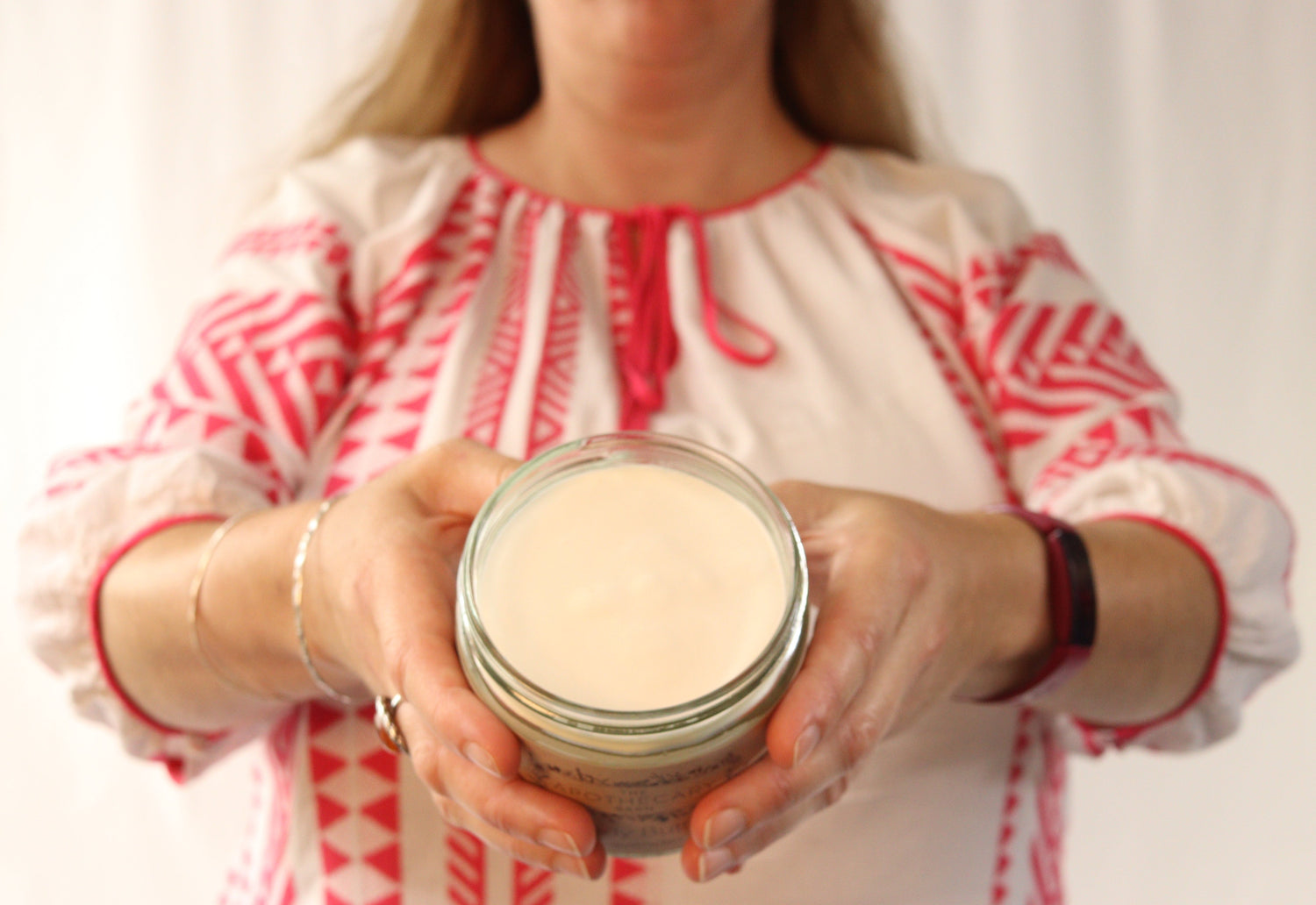 Ellen holding Monah & Co Lavender Body Butter.