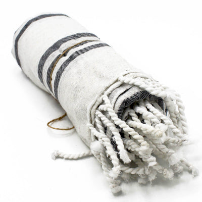Rolled up showing fringe. Hamman Cotton Towel with a charcoal and neutral stripe. 90x170cm